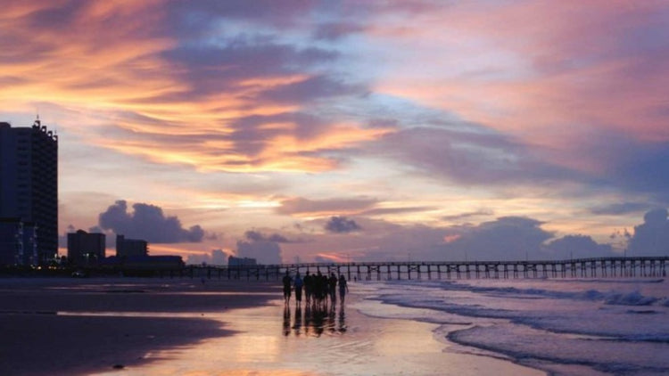 Sunset over the beach and pier at Cherry Grove